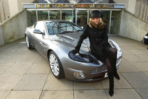 Britt Ekland with an Aston Martin