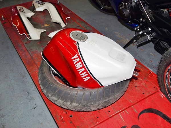 Motorcycle tank sitting inside tyre