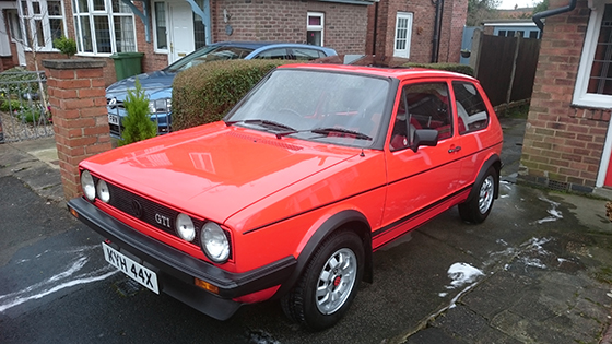 Red Mk1 Golf GTI parked on drive