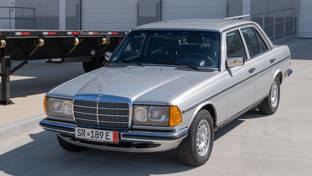 A Mercedes 123 in a sunny car park