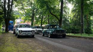 Classic cars on a country lane
