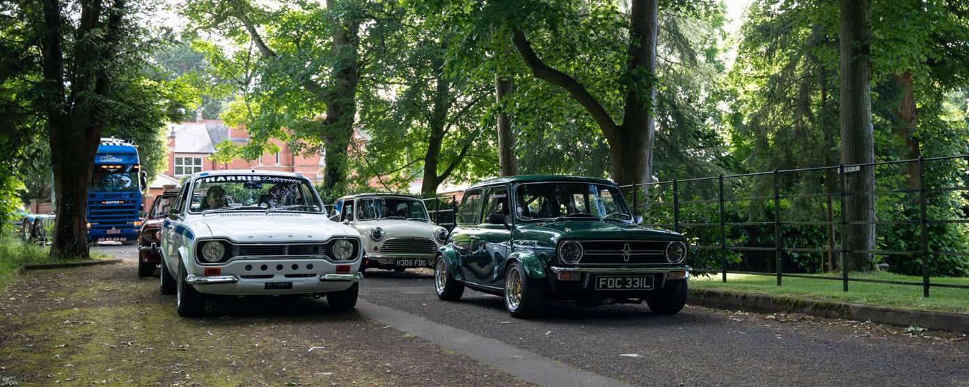 Classic cars on a country lane