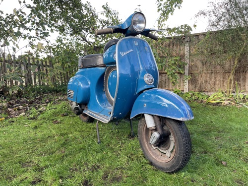 A blue Vespa SS90