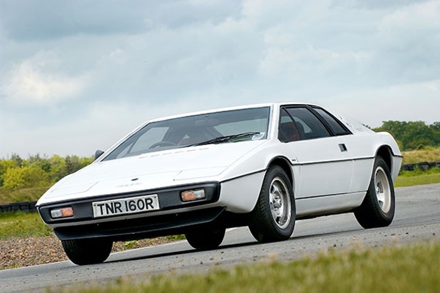 A white Lotus Esprit on a dirt track