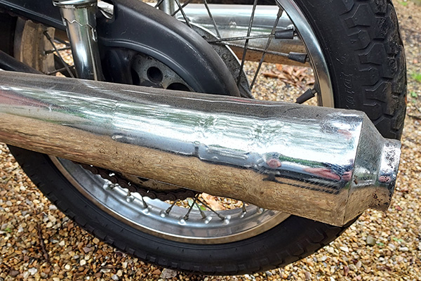 Motorcycle Exhaust Pipe And Rear Wheel Assembly
