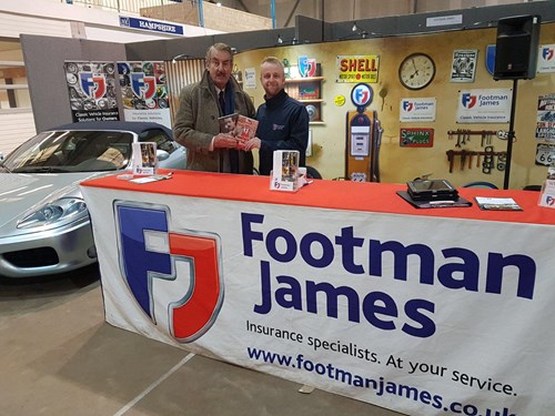2 men posing at Footman James stand