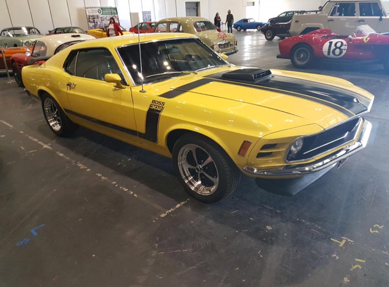 A yellow and black muscle car