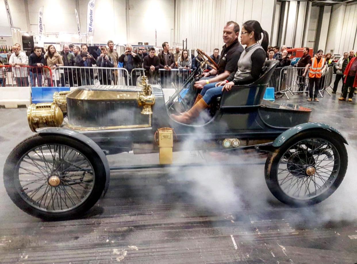A vintage motor being driven to the show