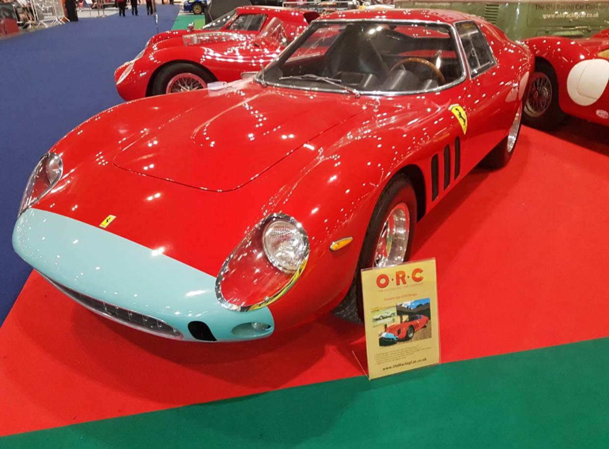 An Old Racing Car Company red Ferrari with baby blue nose