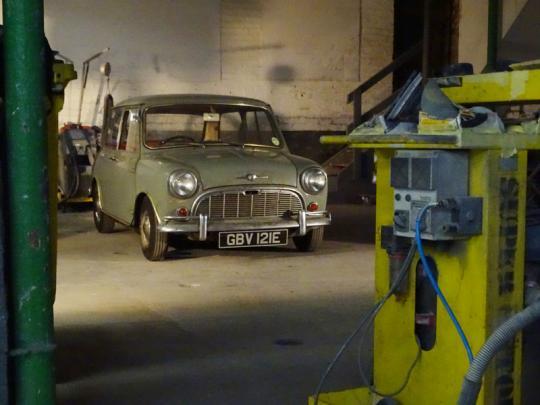 Green Classic Mini in garage