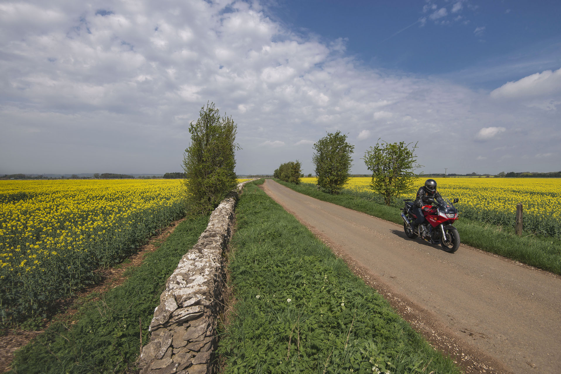 Bike whizzes down country lanes toward the Classic Motor Hub