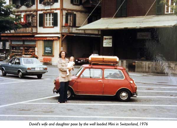 David's wife and duaghter pose by the well loaded Mini in Switzerland