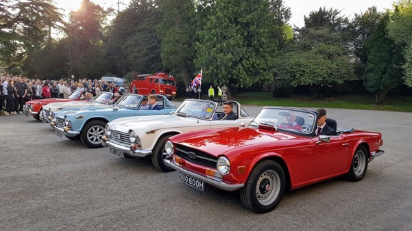 Crowds admiring the Triumphs