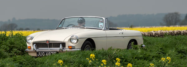 David Bond driving his MGB