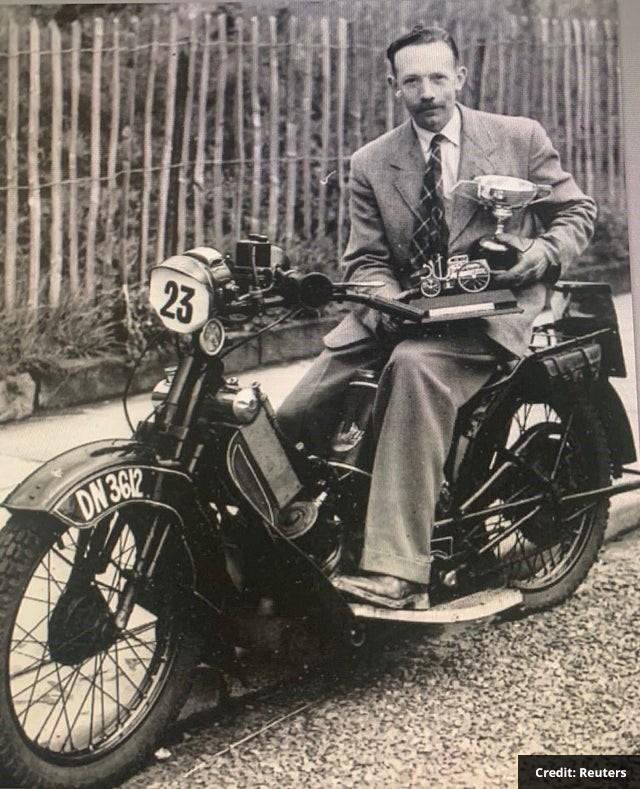 Captain Tom photographed with his trophies, astride his #23 Scott Flying Squirrel