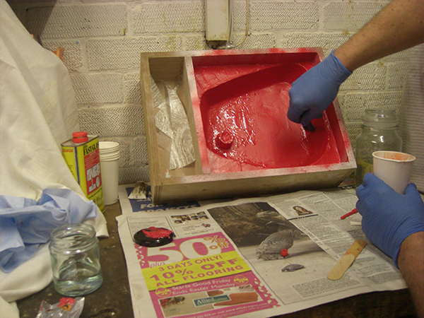 Placing fibre tissue in mould