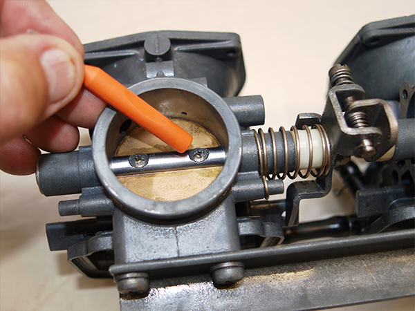 Two screws holding the butterfly into its spindle