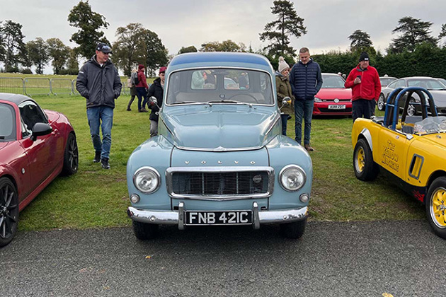 egg-shell-blue-volvo-duett-pv-on-grass-at-chateau-impney