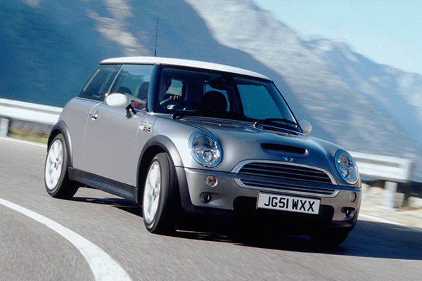 Silver Mini Cooper s on mountain road
