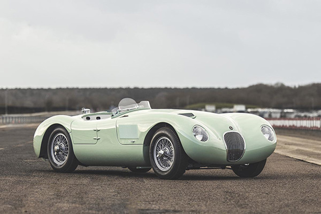 pastel-green-jaguar-c-type-parked-on-race-circuit
