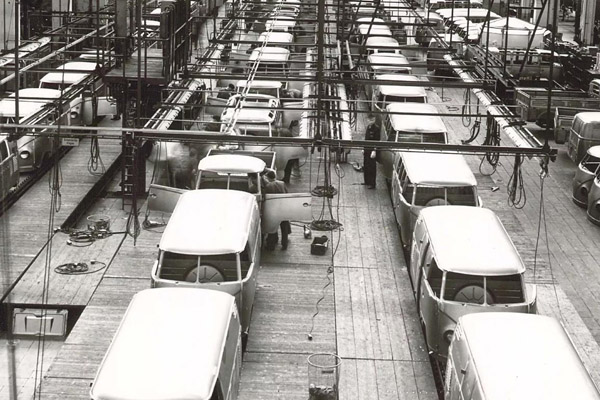 Monochrome Volkswagen Transporters In A Factory In Three Rows