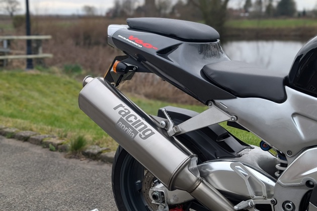 An Aprilia RSV 1000 Mille in front of a lake