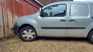 h-side-view-silver-renault-kangoo-van-motorbike-ramp-on-it
