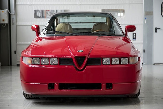 A red Alfa SZ in a workshop