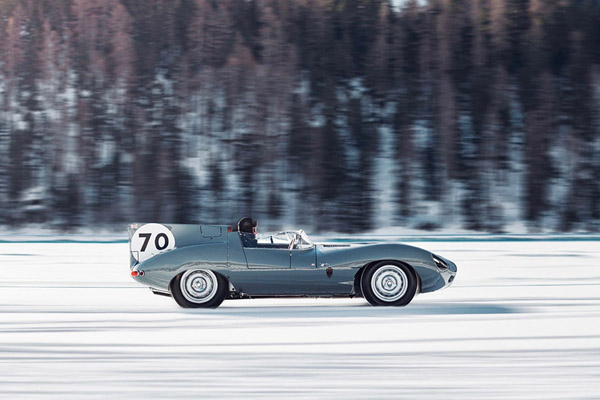 Metallic Light Blue 1954 1957 Jaguar D Type driving though snow Bicester Heritage