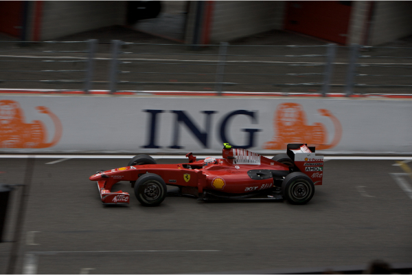 2009 Kimi Raikkonen Driving A Ferrari Formula 1 Car