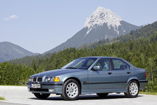 Metallic Light Blue 1990 - 2000 BMW 3 Series E36 Guffert Austrian mountain backdrop