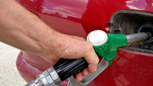 header-fuel-pump-nozzle-refueling-a-red-car