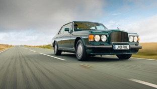 Bentley Turbo R driving along a road