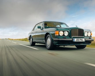 Bentley Turbo R driving along a road