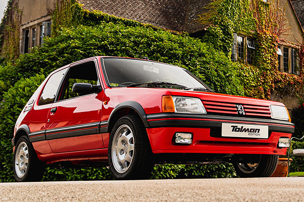 1990S Bright Red Tolman 205 Gti With An Ivy Covered House Backdrop - Courtesy Tolman