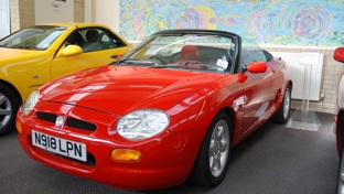 A red MGF in a showroom