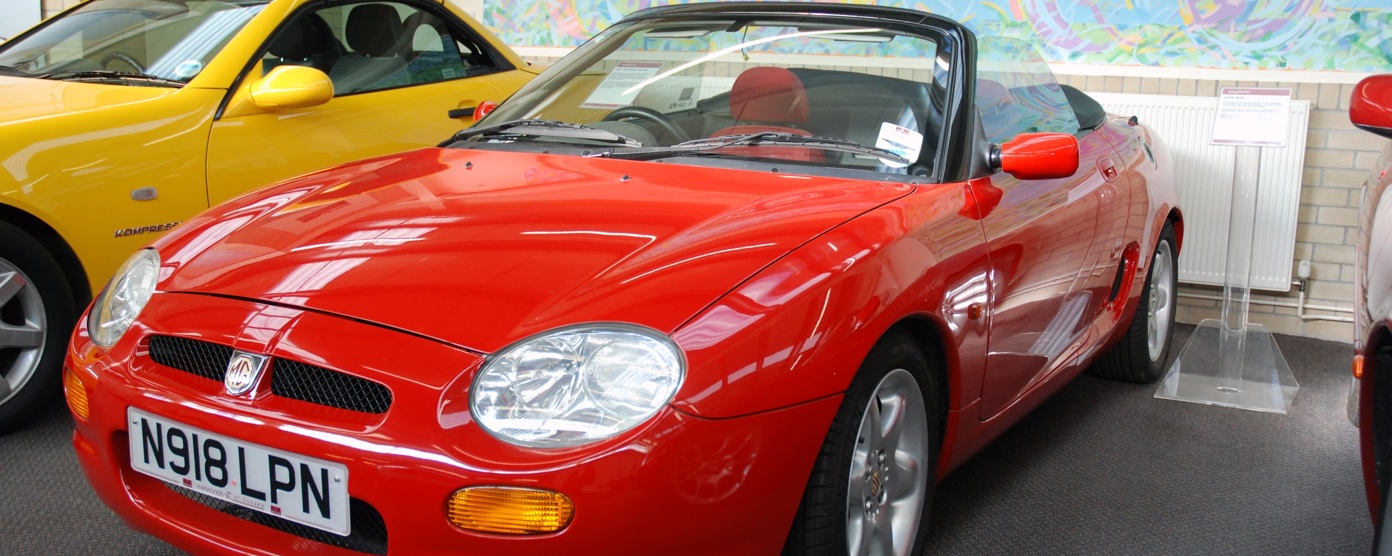 A red MGF in a showroom