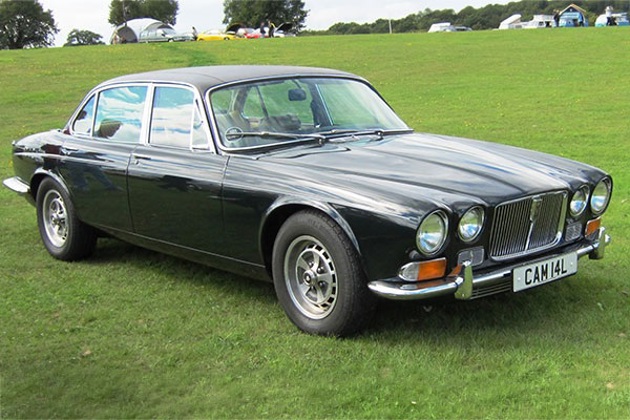 A Jaguar JX12 parked on grass