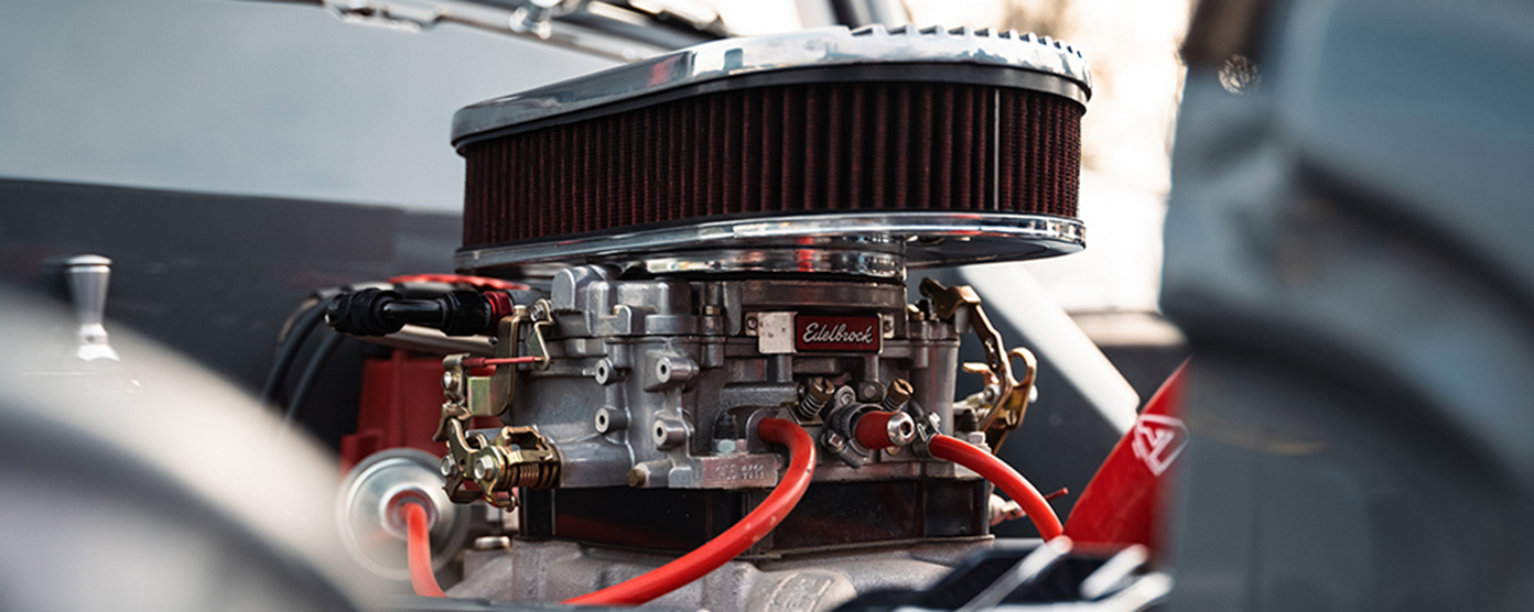 Edelbrock carburetor with air cleaner assembly on an engine