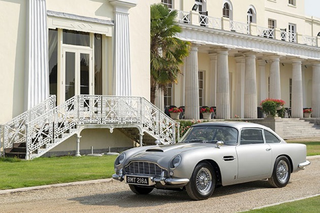 A silver DB5 outside a stately home
