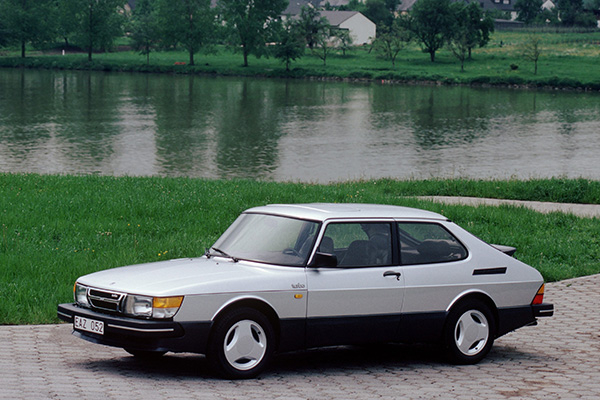Silver saab 900 turbo near a lake