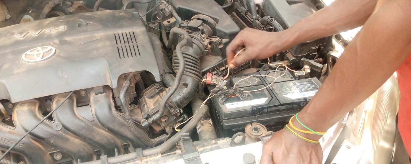 A car battery exposed by an open bonnet