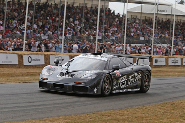 Dark Metallic 1995 Mclaren F1 GTR Racing Past Goodwoods Spectator Stand
