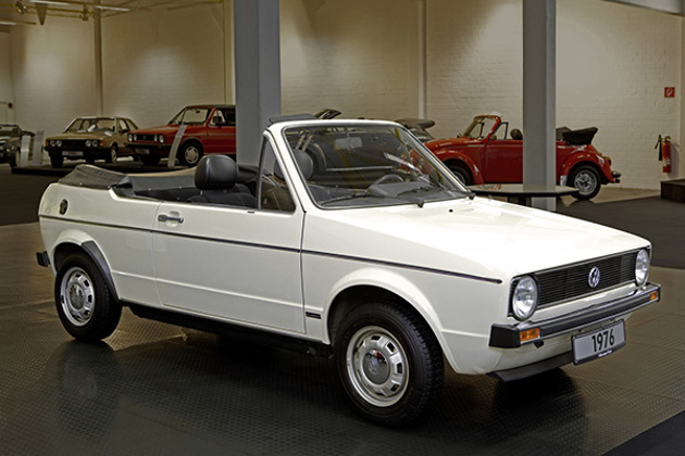 white-vw-golf-cabriolet-convertible-in-a-garage-with-classic-golfs-and-beetles