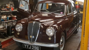 A classic car in a workshop