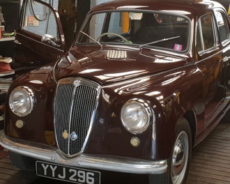 A classic car in a workshop