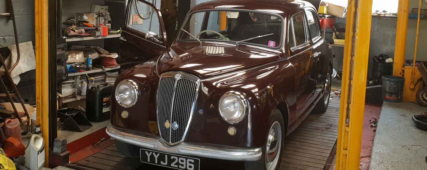 A classic car in a workshop