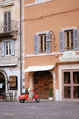 Vespa outside a pizzeria