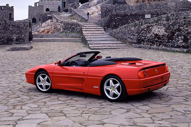 red-ferrari-f355-spider-chiesa-di-san-pietro-catholic-church-in-porto-venere-italy