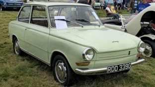 A pea green DAF at a classic car show